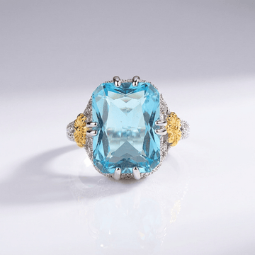 Anel vintage com aquamarine dourado da Rose & Oliver, detalhe elegante e pedra azul em prata envelhecida.