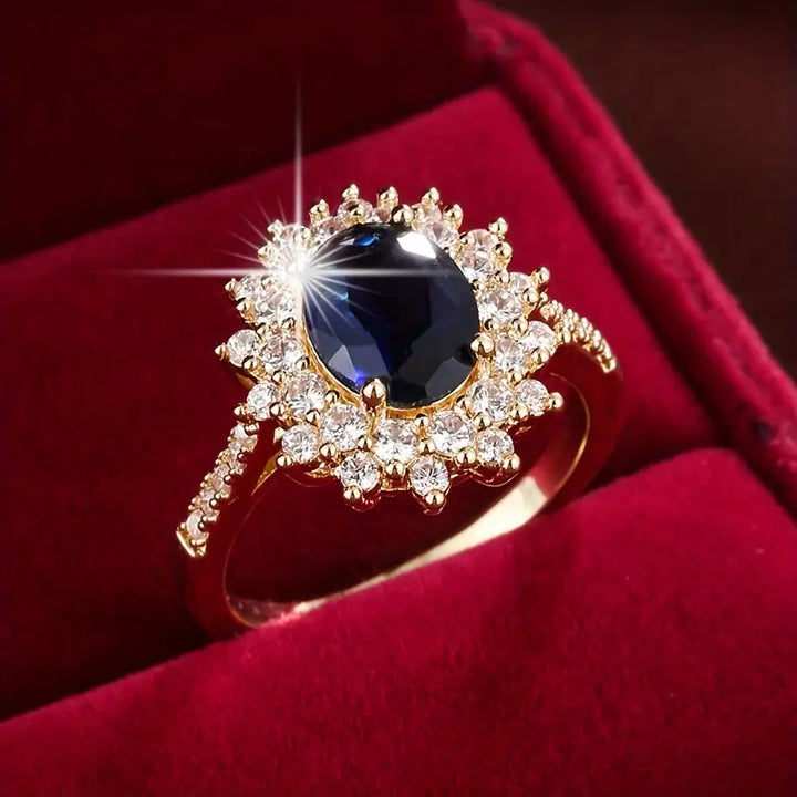 Anel Vionne Saphirae Rose & Oliver em ouro, com design delicado e detalhes elegantes, destacando-se na imagem.
